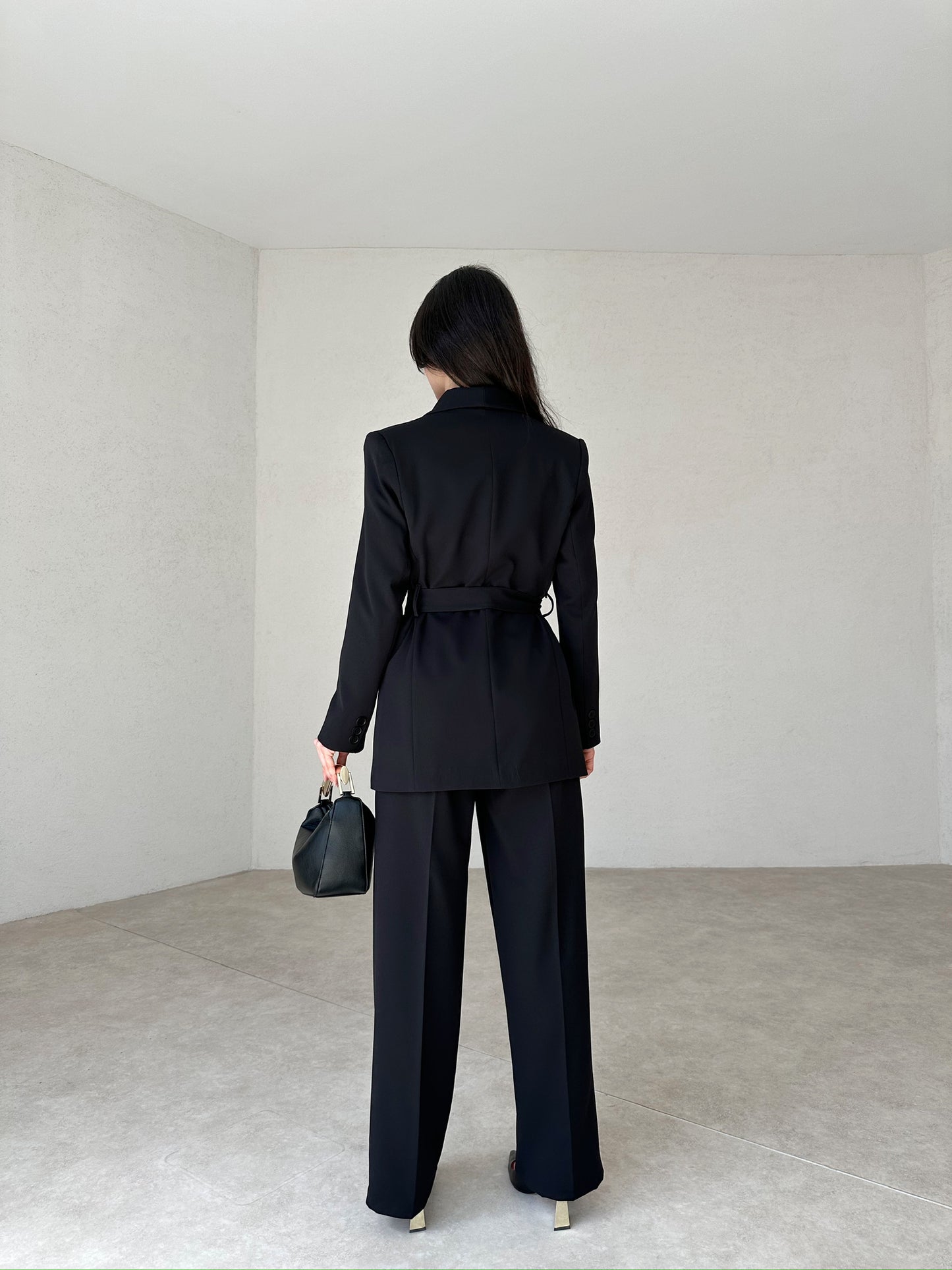 Double-breasted black pantsuit