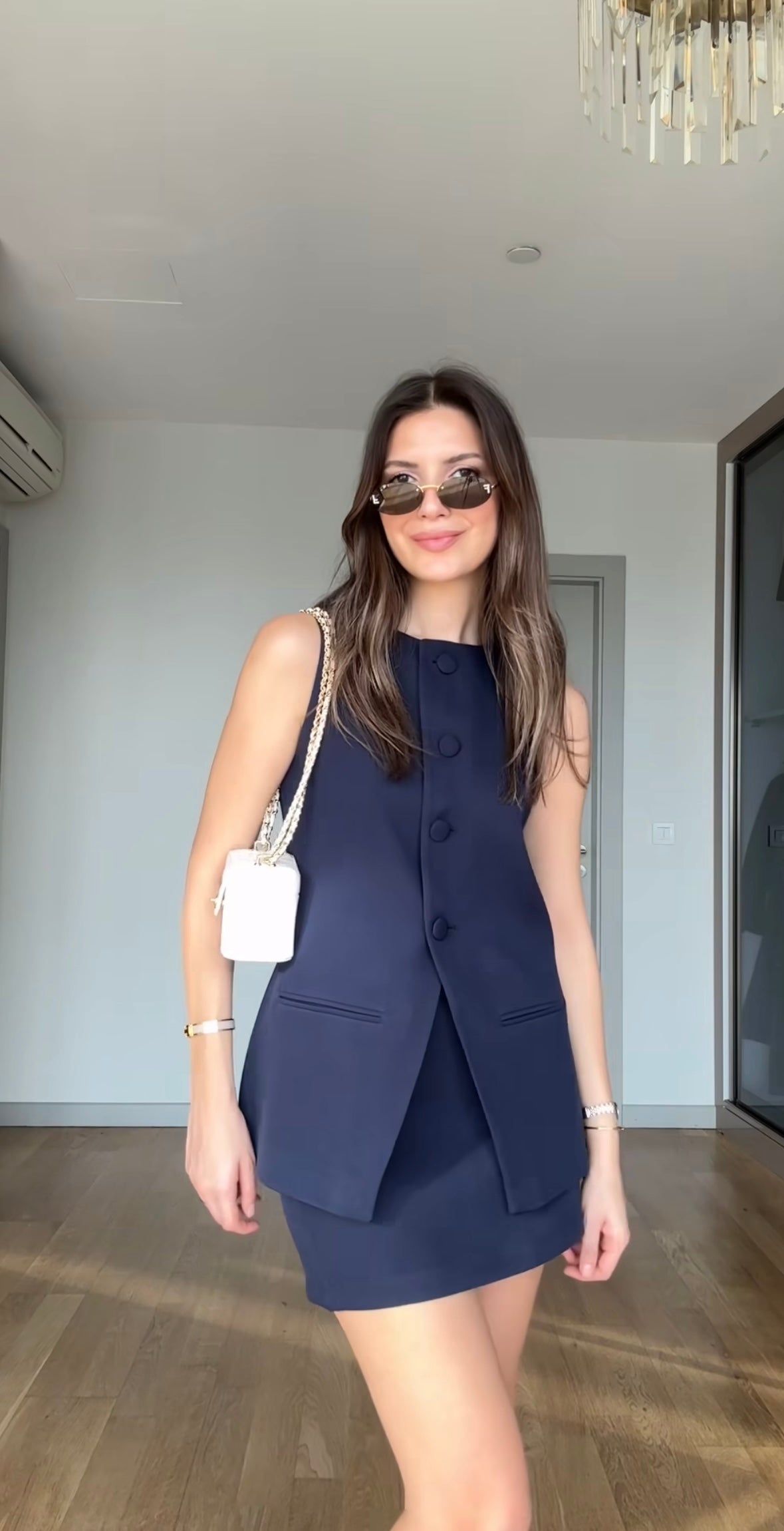 Sleeveless blazer and skirt/shorts set